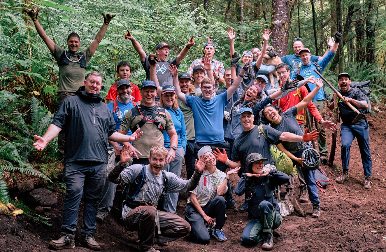 Evergreen trail volunteer crew celebrating after a volunteer work party